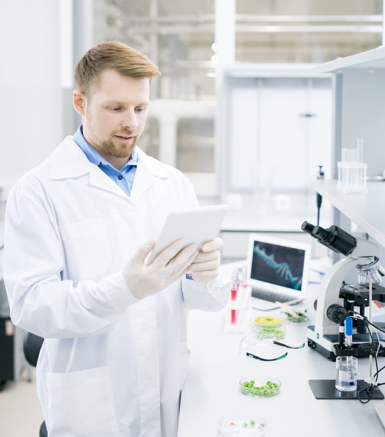 Modern Scientist Using Tablet in Laboratory